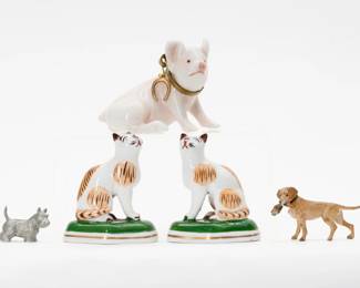 A pair of Chelsea Samson handpainted porcelain cats, gold anchor mark to the base; a porcelain lucky pig wearing gilded collar with horseshoe charm attached to it; a pewter Scottish Terrier stamped Rawcliffe Pewter 1982, and a Bird Dog carrying a duck in its mouth 