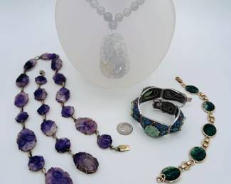 Antique Chinese carved amethyst medallions set as a necklace and matching bracelet, a carved jade pendant and jade bead necklace with 14k gold clasp, a vintage silver filigree and enamel bracelet set with carved natural stone flowers, a gold filled link and carved green stone panel bracelet 