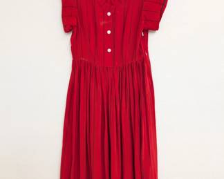 A red silk dress with black pinstripes, button front and short sleeves