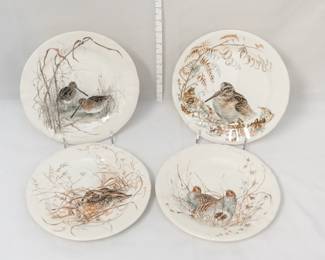 Four dessert or salad plates by Faiencerie De Gien from their Sologne collection. The collection was designed by Estelle Rebottaro and features detailed illustrations of the flora and fauna found in the Sologne region of central France.  