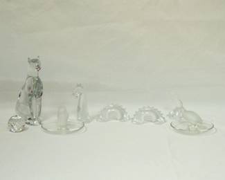 A Swarovski crystal ball, a Baccarat French crystal Egyptian cat figurine, a vintage signed Lalique France frosted and clear crystal hawk ring dish, a Baccarat French crystal Loch Ness Monster figural, and a signed Lalique frosted crystal quail bird ring dish or trinket dish