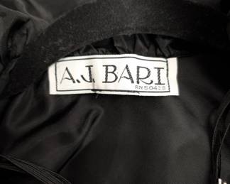 Closeup of the vintage A. J. Bari black taffeta & velvet ruffled evening wrap or cape
