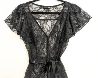 H&M black lace blouse with short ruffled sleeves, button front closure and a black ribbon belt