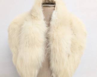 A vintage white fur stole with "The Style Shop Savannah GA" label inside