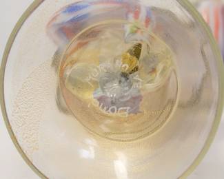 Closeup of base of one of the pair of Murano Art Glass dancing Pierrot figures, handcrafted in Murano, Italy. This type of figure often represents characters from the Italian commedia dell'arte tradition, such as Pierrot or Harlequin. 