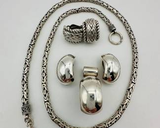 An elegant sterling silver demi-parure in a bold, simple modern style featuring an elongated pendant with matching clip earrings, the pendant will fit onto the included 24-inch long round Byzantine style chain that weighs 64.5 grams, along with another pair of herringbone pattern sterling silver earrings.