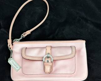 A rare vintage Coach Soho mini buckle wristlet clutch in pink
