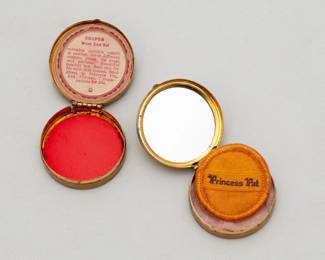 Another view of the two vintage Princess Pat makeup compacts