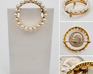 A 14k yellow gold and pearl circular brooch