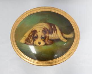 Closer view of the lid of the antique or vintage trinket or jewelry box with a miniature painting of a dog on the hinged lid
