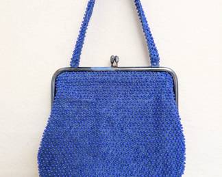 A '60s vintage blue plastic "candy dot" beaded handbag with a kiss-lock closure