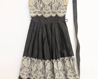 A darling 50's vintage black and white polka dot tea or "patio" dress with white lace trim, shoulder ties and self belt