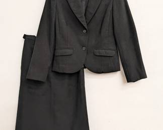 A vintage Pendleton women's black wool skirt suit with two-button blazer and straight skirt, size 8