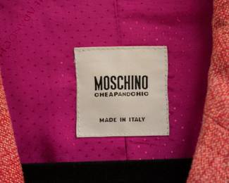 Closeup of Moschino embellished pink jacket made in Italy
