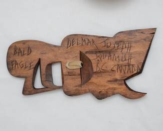 Reverse view of the signed Delmar Joseph carved cedar wood bald eagle totem wall plaque. (Delmar Joseph (b. 1956) is a member of the Coast Salish Nation, Squamish Tribe, from British Columbia, Canada. He learned to carve from his father, the late Chief Larry Joseph.)