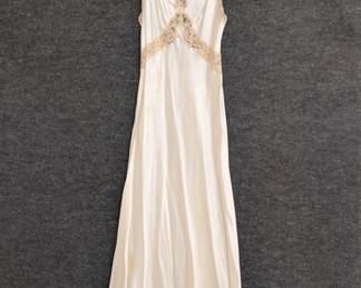 A 1940s vintage nightgown with lace accents, silk or a silk rayon mix