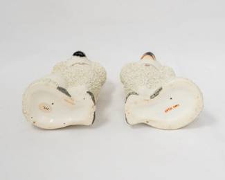 Another view of the pair of antique Staffordshire pottery poodles, often referred to as "confetti" or "gravelware" dogs due to their distinctive textured coats. 