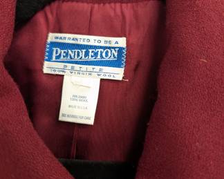 Closeup of vintage Pendleton women's wine-colored wool skirt suit with double-breasted blazer and straight skirt, size Petite