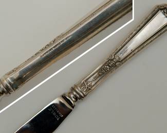 Closeup view of one of the four Towle Louis XIV pattern sterling silver handle fruit or dessert knives with stainless steel blades.