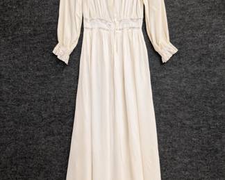 A 1940s Radcliff ivory color dressing robe with lace detailing at neck, waist and cuffs; rayon