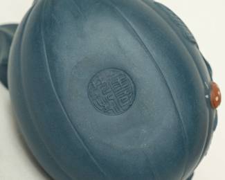 Closeups of Chinese Yixing clay teapots, also known as a zisha teapot, a traditional Chinese style of unglazed stoneware from the city of Yixing