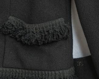 Closeup of vintage 2003 Chanel black suit, jacket size 42, skirt size 40