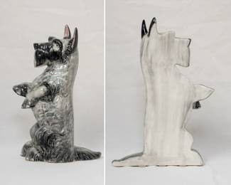 A vintage porcelain Schnauzer dog flat back figurine