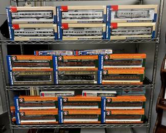 Incredible collection of new in box / NIB model trains from Walthers Ready-To-Run, Walther Classic Heavyweights, Walther Ready-To-Run HO Empire Builder Passenger Cars, Proto 2000 Series HO scale Locomotives (E7, GP7, SD7, SD9), Proto 2000 series Stock Car kits, Proto 2000 series Automobile Box Cars, Proto 1000 Series HO Scale cars, KATO Business Cars, Athearn SE Box Cars,  Proto 1000 Series HO Locomotives, KADEE Boxcars, Broadway Limited Imports Refrigerator Cars, Red Caboose, Three Brothers Manufacturing, California Zephyr locomotives, and much more! This is just one rack of them, we have several!