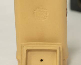 Closeups of Chinese Yixing clay teapots, also known as a zisha teapot, a traditional Chinese style of unglazed stoneware from the city of Yixing