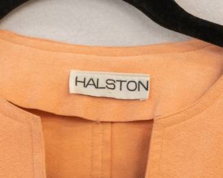 Closeup of peach color Halston 1970s maxi dress 