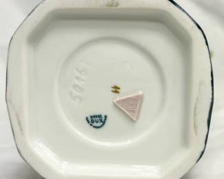 Closeup of one of the pair of Royal Dux Bohemian porcelain ewers/vases  displaying an Art Nouveau style with the baroque twin handles, a sculpted pedestal, and a classic amphora shape