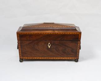 Antique English 18th/19th century coffer shape locking inlaid wooden tea caddy with lion head ring handles; velvet lined lid opening to reveal two lift up lids for tea storage and a compartment for mixing bowl.  Resting on 4 ball feet.