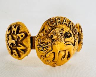 Another view of the vintage Chanel gold tone lion medallion bangle bracelet