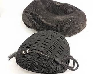 A Jordache black corduroy flat cap or ascot cap, and a vintage black evening hat with a feather and rhinestone embellishment
