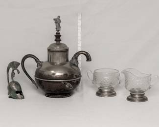 A vintage decorative Roman Trojan brass gladiator helmet bell, an antique Victorian era silver plated teapot in a gourd shape with a pedestal foot, and a figure finial on the lid; and vintage Sheffield Silver Co New York sterling silver and cut glass sugar and creamer set