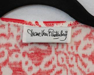 Closeup of the vintage DVF Diane Von Furstenberg red and white wrap dress