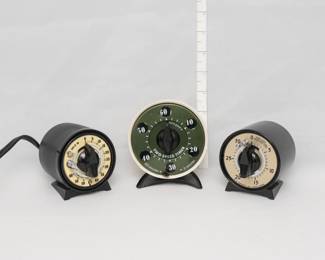 A vintage MH Rhodes #78100 photography darkroom enlarging and film processing timer, a vintage Mark Time two-speed kitchen timer, and a vintage M.H. Rhodes Mark-Time mechanical timer