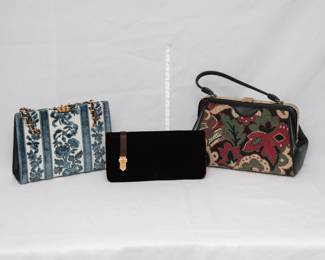 A vintage Meyers blue and white chenille tapestry handbag with gold tone chain handle, a vintage Magid black clutch purse with inside pockets and coin purse, and a Meyers red,  green and black tapestry needlepoint handbag