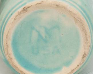 Closeup of vintage Nelson McCoy Pottery Butterfly pattern vase in an aqua matte glaze, circa 1940