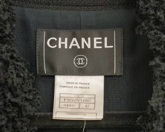 Closeup of vintage 2003 Chanel black suit, jacket size 42, skirt size 40