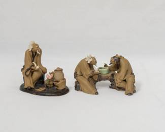 A vintage pair of Chinese Mudman figurines, also known as a Shiwan ware figurines