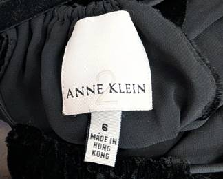Closeup of Anne Klein 2 black velvet halter neck sleeveless dress, size 6