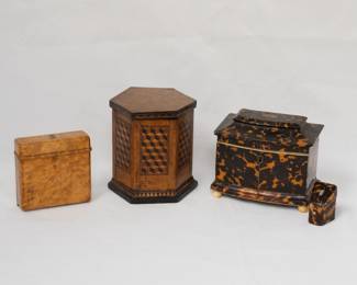 A marvelous antique carved burled wood cigarette case that expands into two storage areas with a storage compartment for matches or lighter in the top; a 19th century antique English hexagonal tea caddy with hinged lid and featuring a distinctive wooden marquetry inlay design with a tumbling blocks pattern, the interior with another wooden lid over a lined compartment; and a fabulous William IV / early Victorian tortoiseshell locking tea caddy of rectangular form,  the shallow pagoda top opening to twin lidded compartments, on plinth base and ball feet; along with a matching stamp case or needle case.