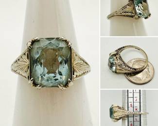 An 18kt gold Art Deco aquamarine colored ring size 5-3/4 to 6.