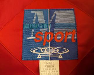 Closeup of vintage Mulberry Street red and yellow geometric pattern hooded zip front winter coat, size Small