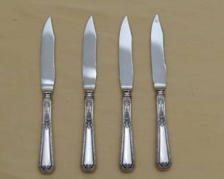 Four Towle Louis XIV pattern sterling silver handle fruit or dessert knives with stainless steel blades.
