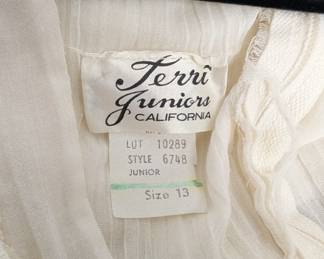 Closeup of the vintage Terri Juniors white maxi dress with cap sleeves, size 13