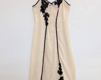 Vintage cream nylon slip with black lace accents, probably from the 50's