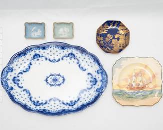 A pair of Tharaud Limoges France porcelain trinket dishes with neoclassical charioteers decoration, an antique W.H. Grindley flow blue ceramic platter, Staffordshire, England; an antique Wedgwood porcelain octagonal dish circa 1878-1900, Blue Willow pattern scene done in gold gilding over a solid dark blue ground; a vintage Royal Doulton decorative plate featuring the H.M.S. Bounty (this plate is part of the "Famous Ships" series produced 1938 through 1958 by the company.)