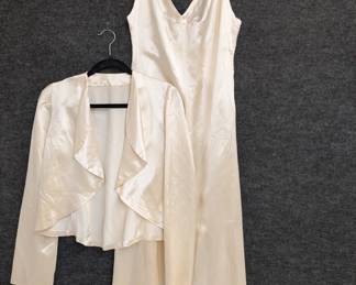 Another view of the ivory color (possibly Rayon) satin evening dress with matching boleo jacket – this would be an amazing wedding dress!